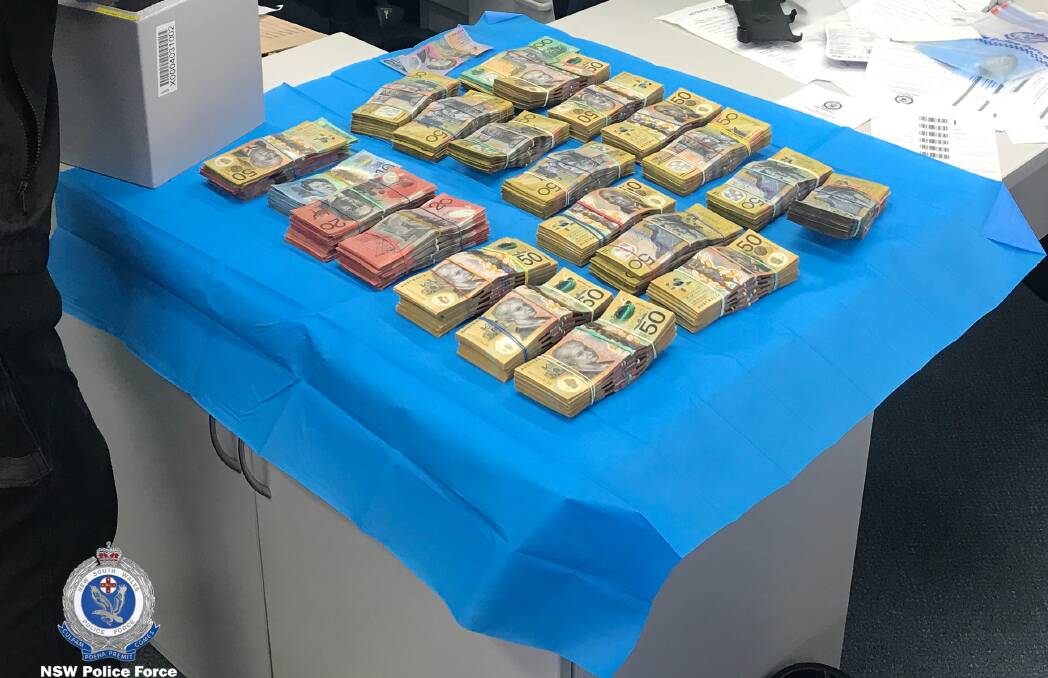 HAUL: Cash seized by police during Wednesday morning's Bay and Basin raids, Photo: NSW Police