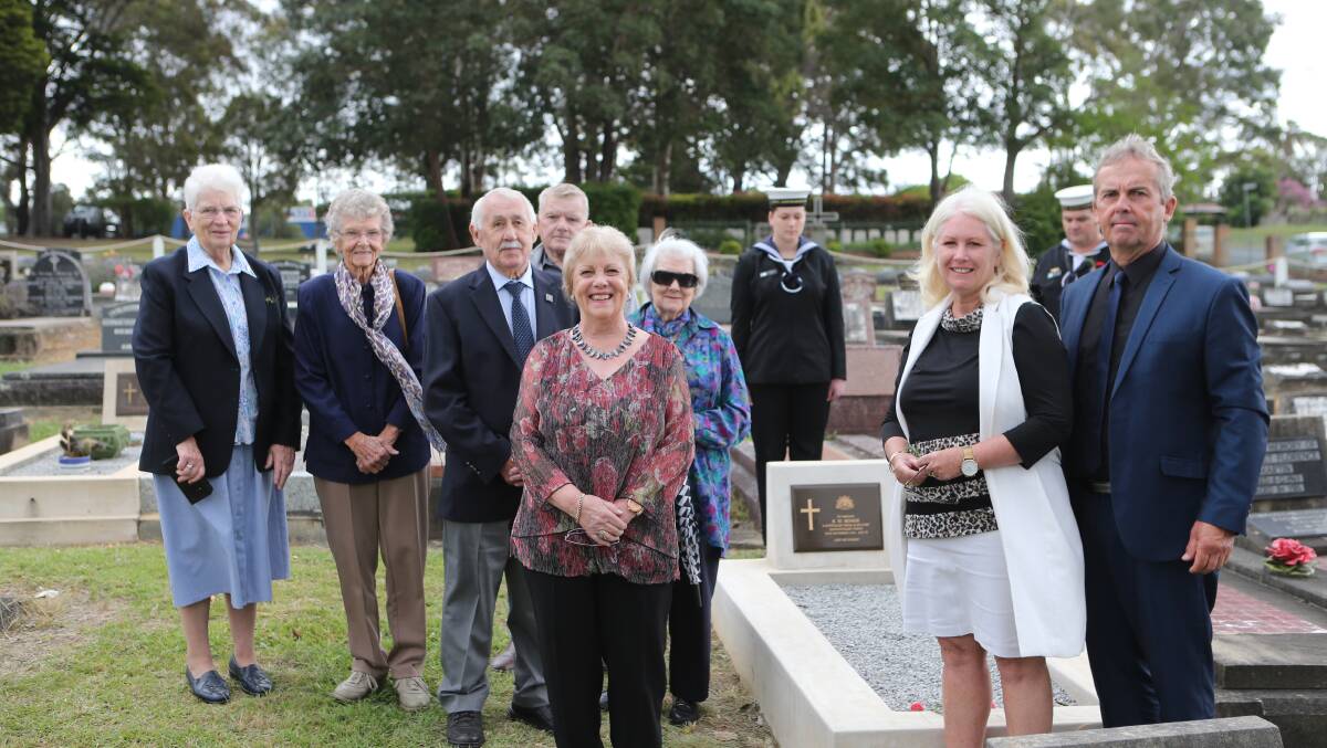 HONOURED: Members of Private Robert Senior's family around his new grave at the Nowra General Cemetery.
