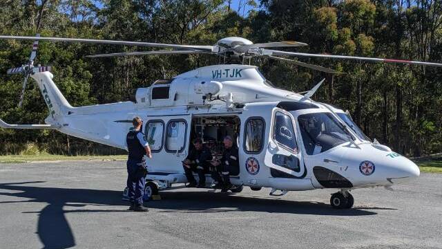 The Toll NSW Ambulances Rescue Helicopter has landed at the Log Cabin at Tomerong. Photo: Stuart Thomson

