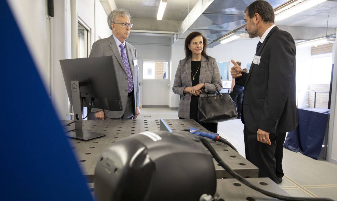 INNOVATION: UOW Vice-Chancellor Professor Paul Wellings, Senator Concetta Fierravanti-Wells and UOW Director of the Facility for Intelligent Fabrication Dr Paul Di Pietro in the Nowra Agri-business Innovation Hub. Photo: Mark Newsham