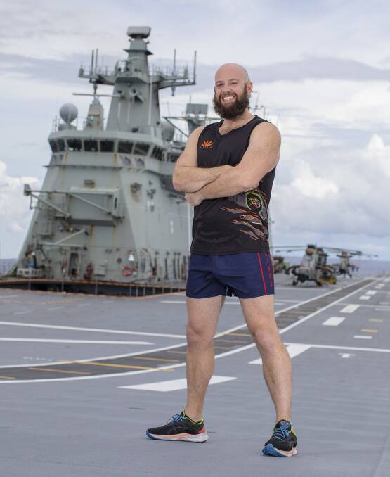 GOING THE DISTANCE: Leading Seaman Scott Tunnard has completed some long kilometres running on the flight deck of HMAS Canberra during Regional Presence Deployment 2020. Photo: Tom Gibson