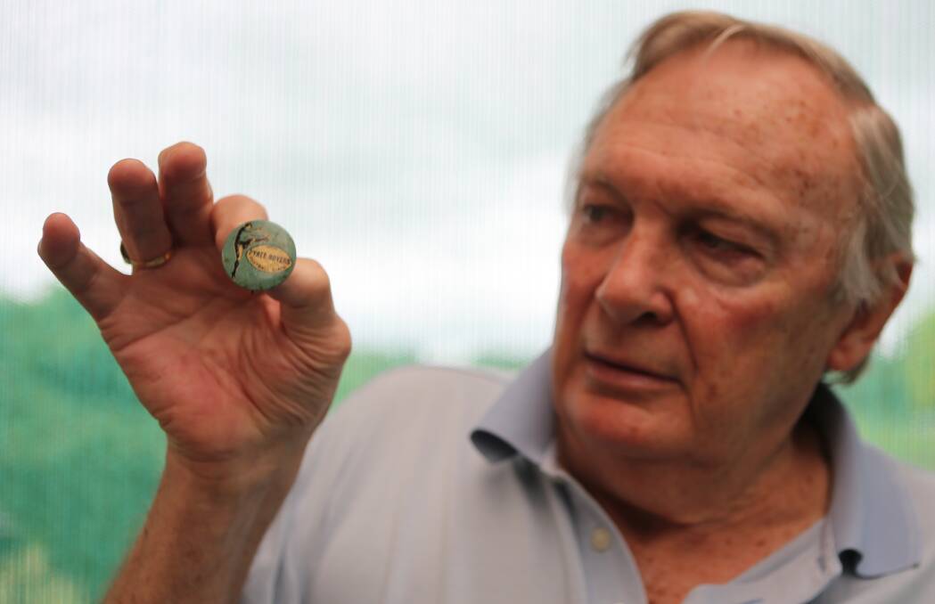 PRIZED POSSESSION: Nowra man Geoff Carter shows off his historic Pyree Rovers Football Club pin.