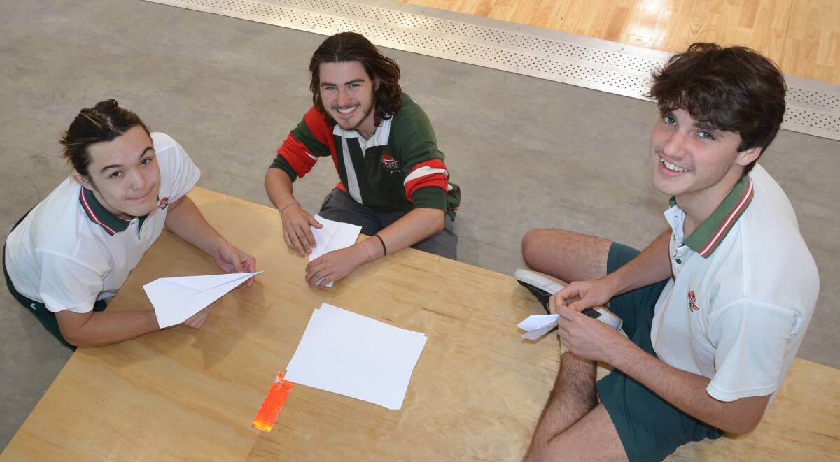 DESIGNS: Angus Israel, Jaidyn Murphy and Ari Britton from Bomaderry High work on their planes.