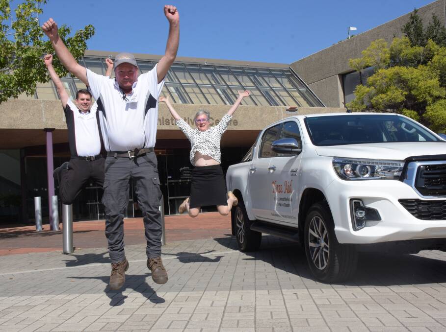 YOU BEAUTY: Nowra Toyota senior salesman Michael Coleman, Shoalhaven Mayor Amanda Findley and BlazeAid Milton co-ordinator Patrick Berkery celebrate the delivery of the group's new vehicle.