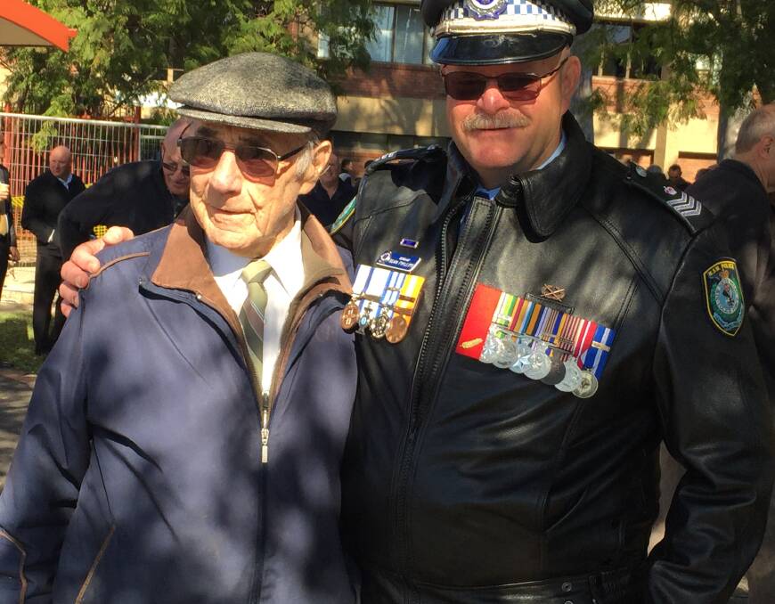 INSPIRATION: Retiring Sergeant Sean Phillips with his first "boss", former Chief Inspector Eric Edgecombe, who worked together in Cootamundra in 1987.

