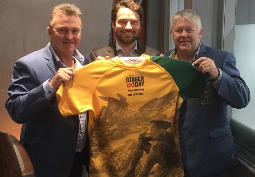 Keith Payne VC Veterans Benefit Group chairman Rick Meehan (left) and vice-chairman Fred Campbell present Hancocks of London owner Guy Burton with a Digger Day jersey.