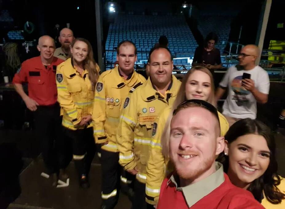 Well-known NSW RFS media officers and former local James Morris (front) with some of the Shoalhaven members before they went on stage at the Fire Fight Australia concert in Sydney.