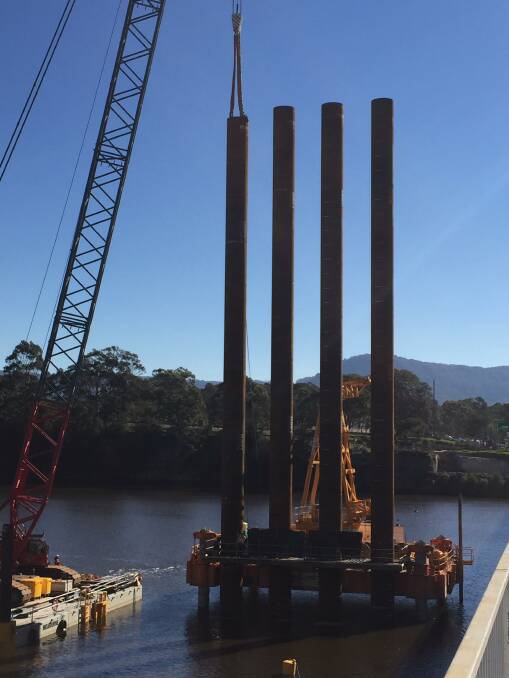 WATER WORKS: The first of the piles from barges into the actual Shoalhaven River for the new Nowra bridge have started.