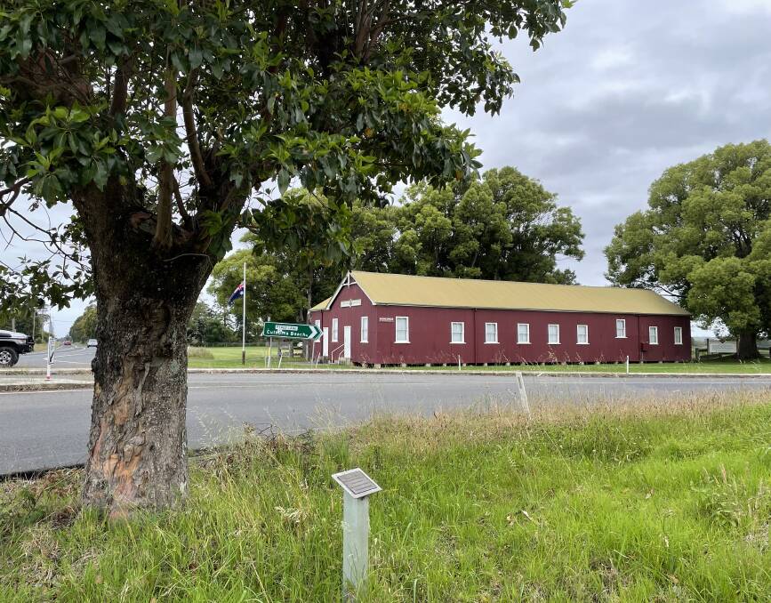 LEST WE FORGET: The memorial tree at the corner of Pyree Lane and Greenwell Point Road, Pyree, east of Nowra, with the Pyree Literary Institute in the background.
