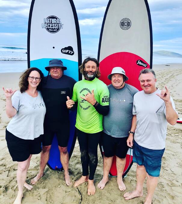 GRADUATES: Veteran Surf Project coordinator Rusty Moran (centre) with four of the first graduates from the program (from left) Suz Dendle, David Biddle, Fred Campbell and Rick Meehan. 