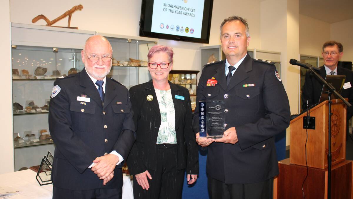 AWARD: SESCA Ambassador Dr Peter Taylor and Shoalhaven Mayor Amanda Findley present Shoalhaven Officer of the Year (salaried category) was NSW Fire and Rescue's John Dun.