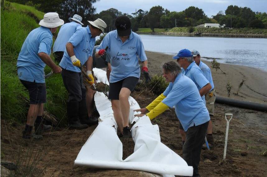TOP WORK: Shoalhaven Riverwatch volunteers installing another geo fabric sand sausage on Pig Island.