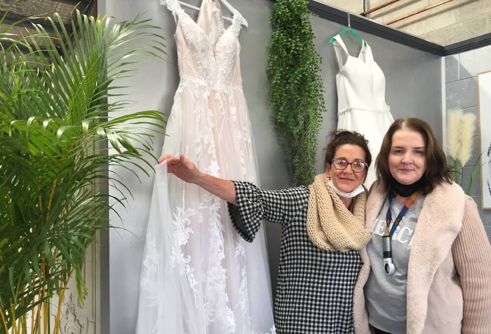 CONFIDENCE: Vicki Lowbridge and Lisa Etheridge say having wedding dresses dropped off for cleaning has been a real boost to their confidence.