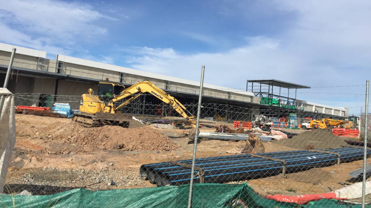 GOING AHEAD: The $13.8m Woolworths Bomaderry complex is certainly progressing, with hopes it might be open in August.