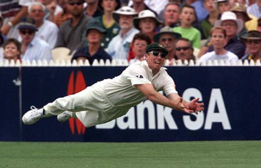 SPECTACULAR: The best photograph Colin Whelan says he ever took during his career, that spectacular catch by Aussie fast bowler Glen McGrath during the Ashes Test at Adelaide Oval in 2002. The photo was front page on a number of national newspapers around the country.

