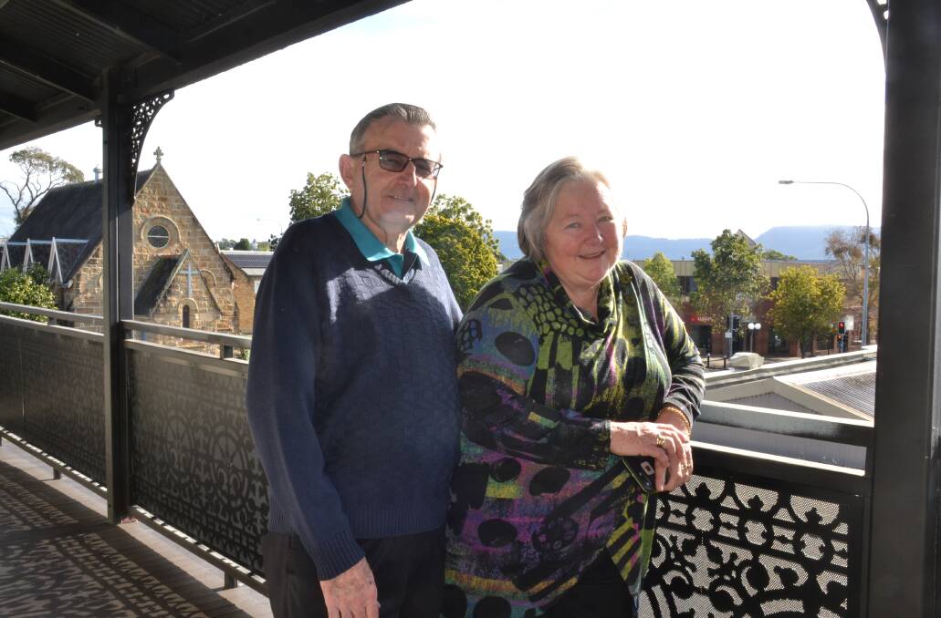 BEAUTIFUL: Les and Catherine Bryant on the restored verandah of teh historic guiloding.
