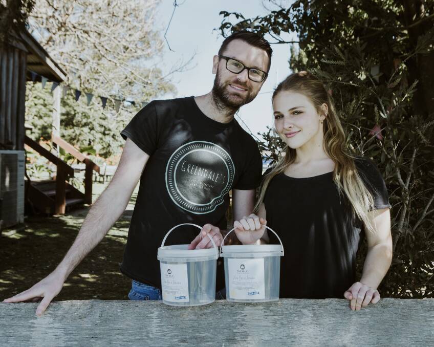 BACKING: Greendale's Alan Harvey and staff member Tahlia Bruce with the Milk It Forward Buckets which will also be available to take donations at tomorrow’s event.