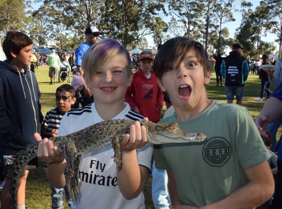 CROC HUNTER: Caleb Nelson and Tyrone Ginn got up close and personal with a scaly critter at last year's Shoalhaven NAIDOC Family Fun Day. Photo: Zoe Cartwright