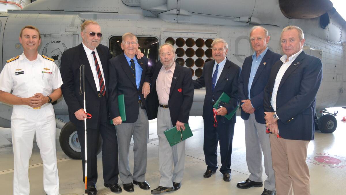 US HONOUR:  Commander Fleet Air Arm, Commodore Chris Smallhorn (left) presented the United States Air Medal to  David Cronin, Vic Battese, Gordon Edgecombe, Neil Ralph, Stafford Lowe and Jeff Dalgleish, who were members of the first rotation of Royal Australian Navy aircraft to serve in Vietnam.