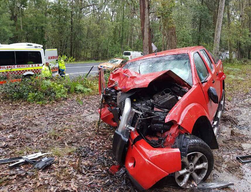 LUCKY ESCAPE: A man escaped with minor injuries after his ute left the Princes Highway near Basin View on Wednesday afternoon and collided with a tree. Photo: St Georges Basin RFS

