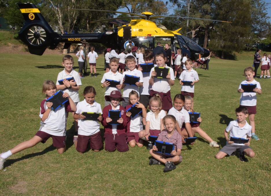 Nowra Public students used iPads to record a visit to the school from helicopter from HMAS Albatross during Anzac Day activities.