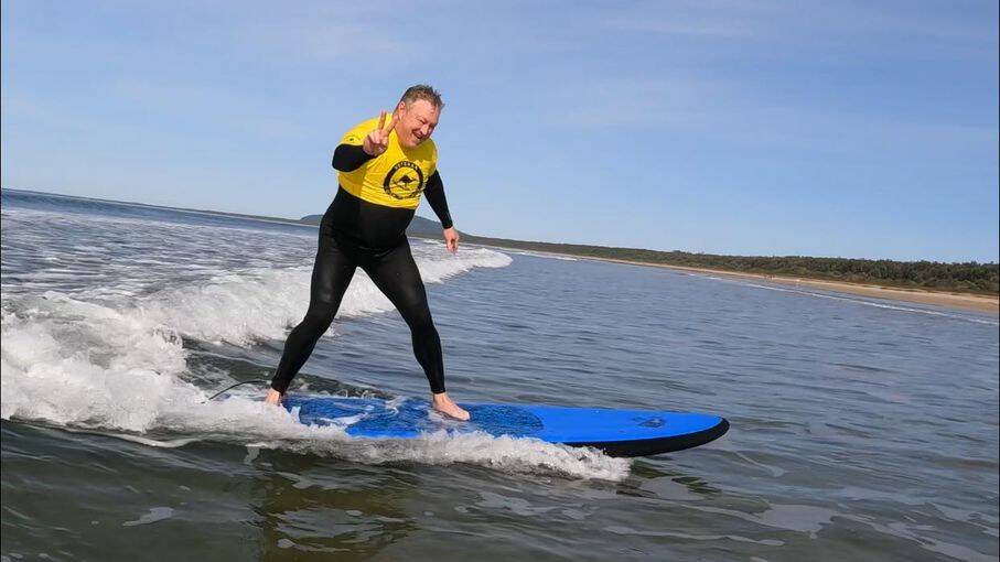 ON THE WAVE: Current serving navy member Craig Daniel on the waves at the Veteran Surf Project.