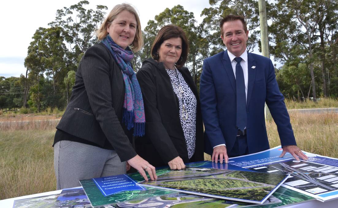PLANS: Transport for NSW Regional Director Southern Sam Knight, South Coast MP Shelley Hancock and Minister for Regional Transport and Roads Paul Toole look over the proposals for the Princes Highway south of Nowra..