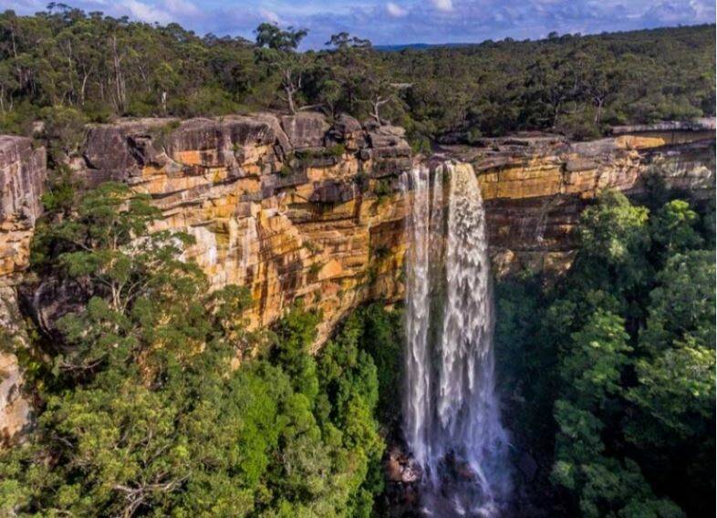 SPECTACULAR: Tianjara Falls is created by water from the Yarramunmun Creek dropping off sandstone cliffs and into the valley below. Image: Shoalhaven Tourism