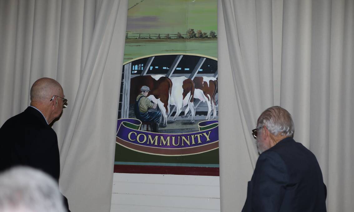 Pyree Hall life members Ian Morison (left) and Geoff Herne unveil the hall's new mural, officially dedicated as part of the 125 year celebrations.
