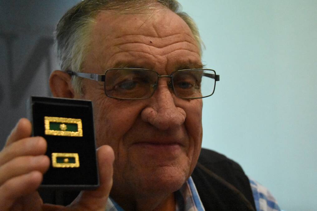Nowra Vietnam veteran Barry Brown with the unit citation for gallantry awarded at the 50th anniversary of the Battle of Fire Support Base Coral and Balmoral for the defiance of the continual enemy attacks.