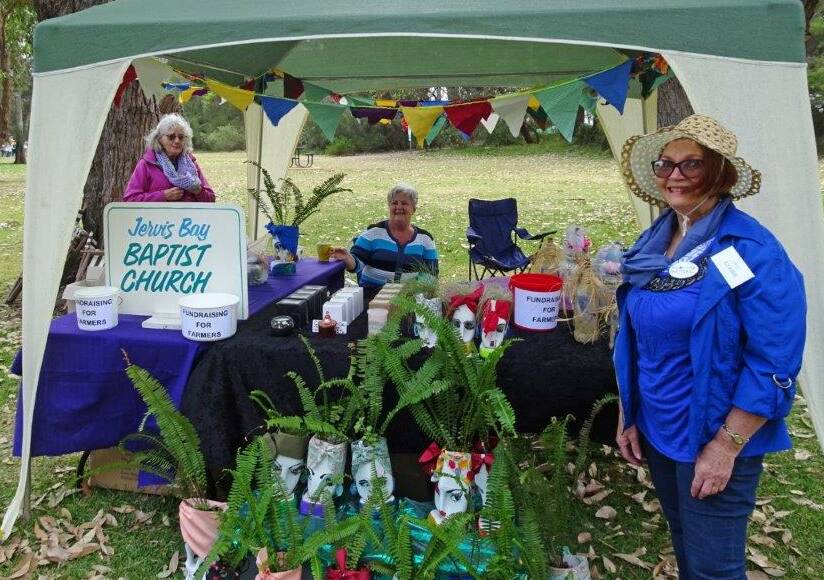 The Jervis Bay Baptist Church stall at the Vincentia Matters' Community Day was raising money for the farmers (from left) Jenny Griffin, Lois Friend and Kerrie Corish.