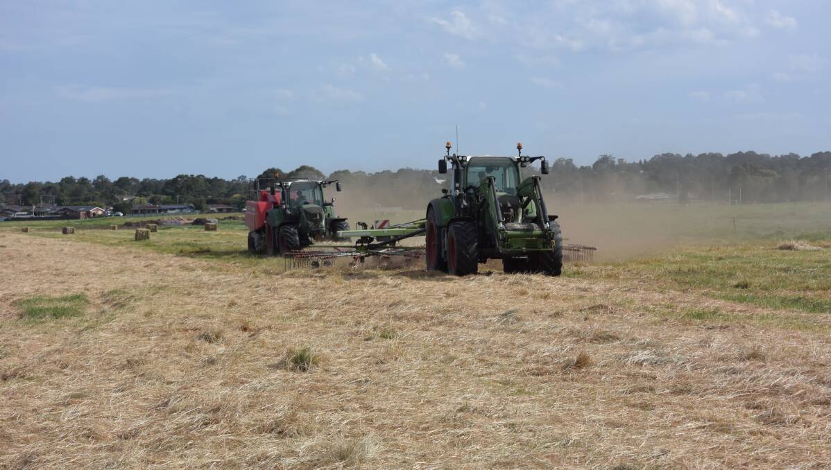 Henry Rural Contracting baling hay at the Wondalga Farm just east of Nowra on Friday afternoon destined for drought-stricken farmers in Western NSW. 