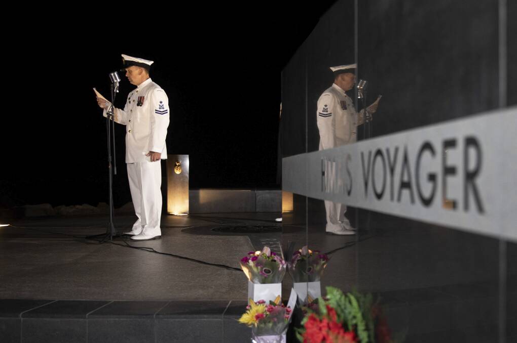 RESPECT: Royal Australian Navy Petty Officer Bosun Christian Duncan from HMAS Creswell, reads the ode during last year's HMAS Voyager memorial service at the Voyager Memorial Park. Photo: Cameron Martin
