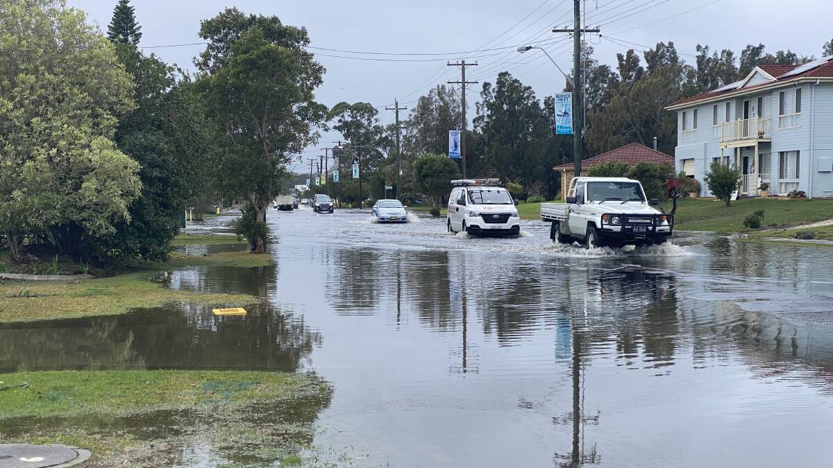 BIG WET: Motorists tackle floodwaters on Jacobs Drive at Sussex Inlet. 