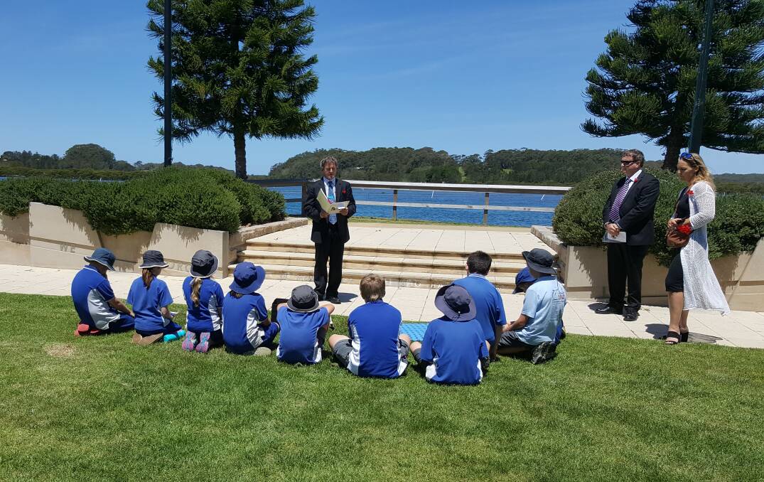 Shoalhaven City Councillor Mark Kitchener talks to Greenwell Point Public School students at Anzac Park.