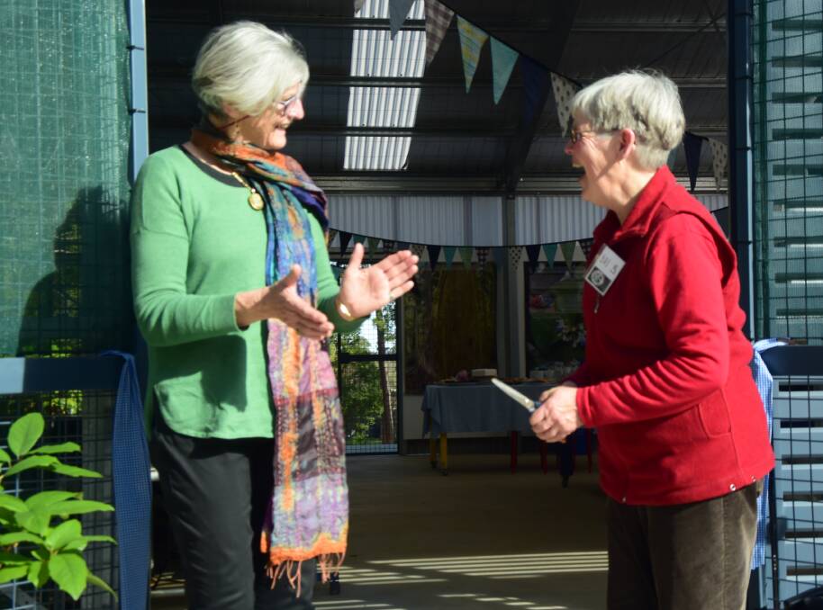 Berry Public plant propagation volunteers Jenny Clapman and Lyn Clark cut the ribbon to officially declare the Plant Propagation and Natural Studies Centre open.