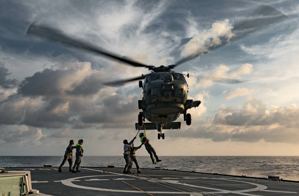 A MH-60 Romeo helicopter from 816 Squadron at HMAS Albatross at Nowra is onboard HMAS Toowoomba in the Middle East region. Photo: Steven Thompson