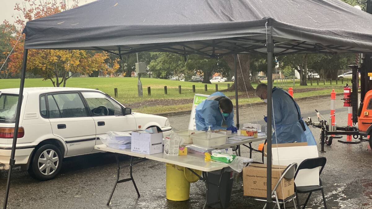 TESTING CONTINUES: Despite the rain testing at the Nowra Showground pop-up COVID-19 testing site continues on Thursday morning. Photo: Grace Crivellaro