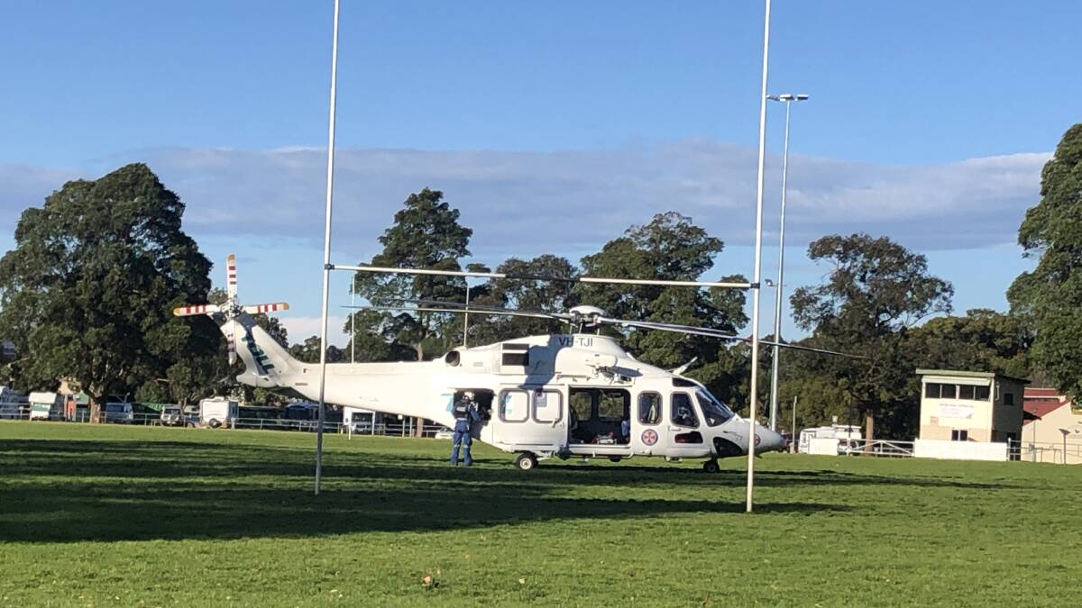 READY: The Toll NSW Ambulance Rescue Helicopter has landed at the Berry Showground and will airlift the injured man to hospital. Image: Supplied