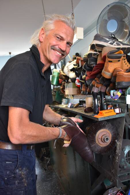 SKILL: Jan van Arkel works his magic on another repair at John's Shoe Repairs.
