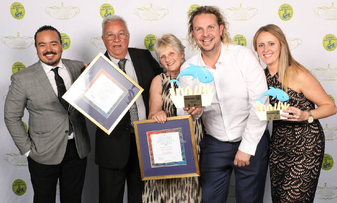 Greenwell Point Pelican Rocks Cafe owners Sam and Rebecca Cardow celebrate their NSW best fish and chips win with Sam's parents Ron and Colleen and presenter Adam Liaw.
