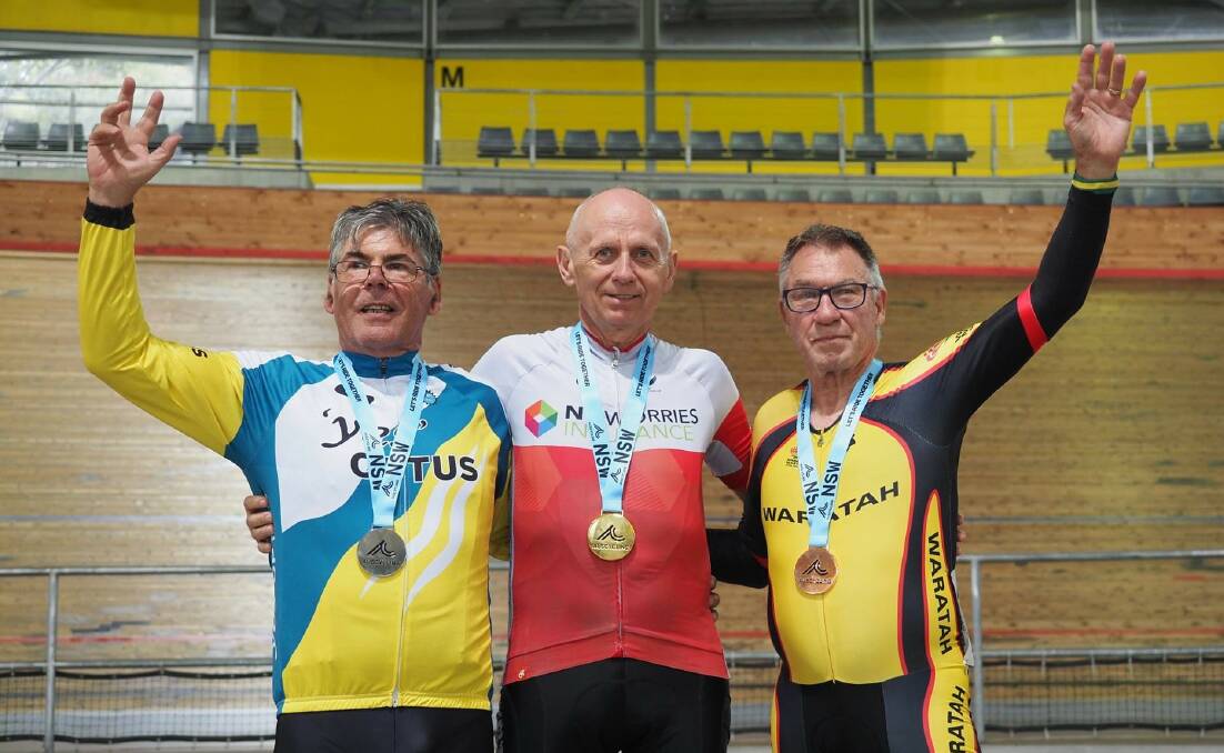 PODIUM: Adrian McMillan (left) on the podium with his Masters 8 silver medal from the scratch race. Image: Supplied
