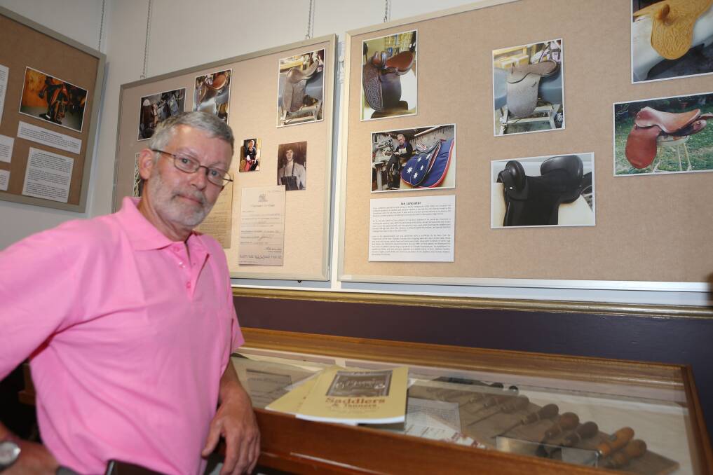 Saddler Ian Lancaster, who started his trade in Berry, looks over the display at the Nowra Museum.