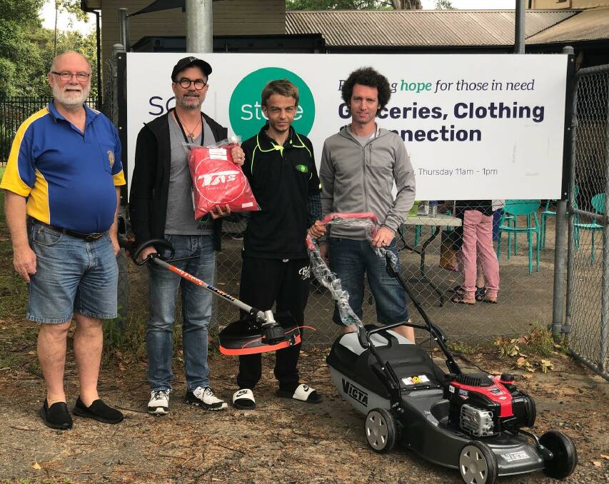 HAND OVER: Bomaderry Lions Club president Bob Mortyn makes the presentation of equipment outside SALT's HQ in Birriley Street, Bomaderry to Pastor Peter Dover, Jesse Egan and Community Pastor Mitchell Hudson.