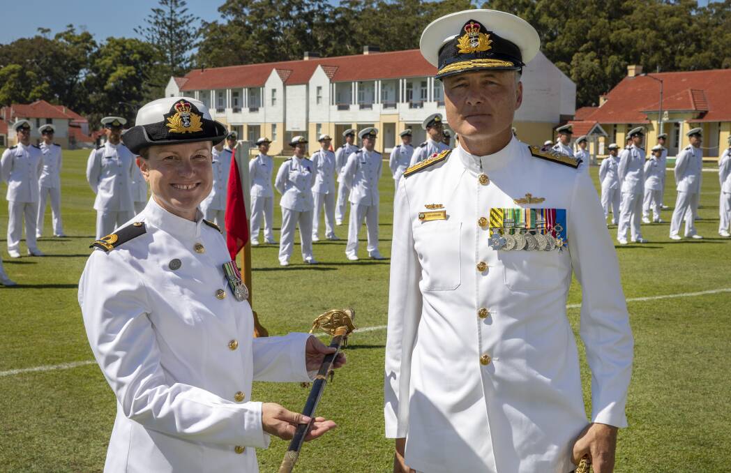 AWARD: Acting Sub Lieutenant Carolyn Johnsen is presented the Rear Admiral Hammond sword for the most outstanding graduate by Rear Admiral Lee Goddard, CSC, during the New Entry Officers Course 63 Graduation parade at HMAS Creswell, Jervis Bay. Photo: Cameron Martin