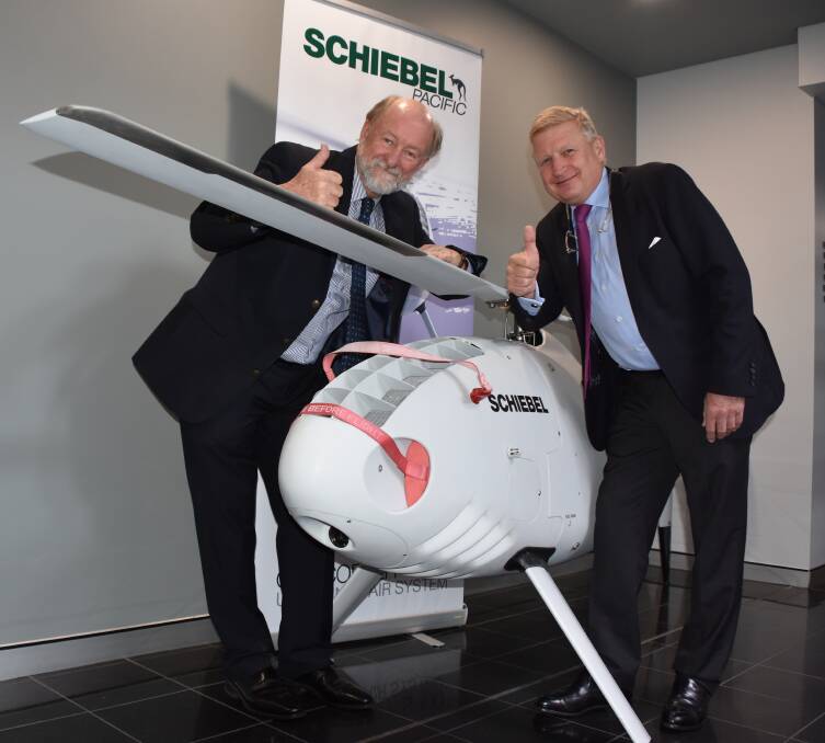 SKY'S THE LIMIT: Air Affairs Australia CEO Chris Sievers (left) and Schiebel Group chairman Hans Georg Schiebel celebrate their new partnership at the Albatross Aviation Technical Park.