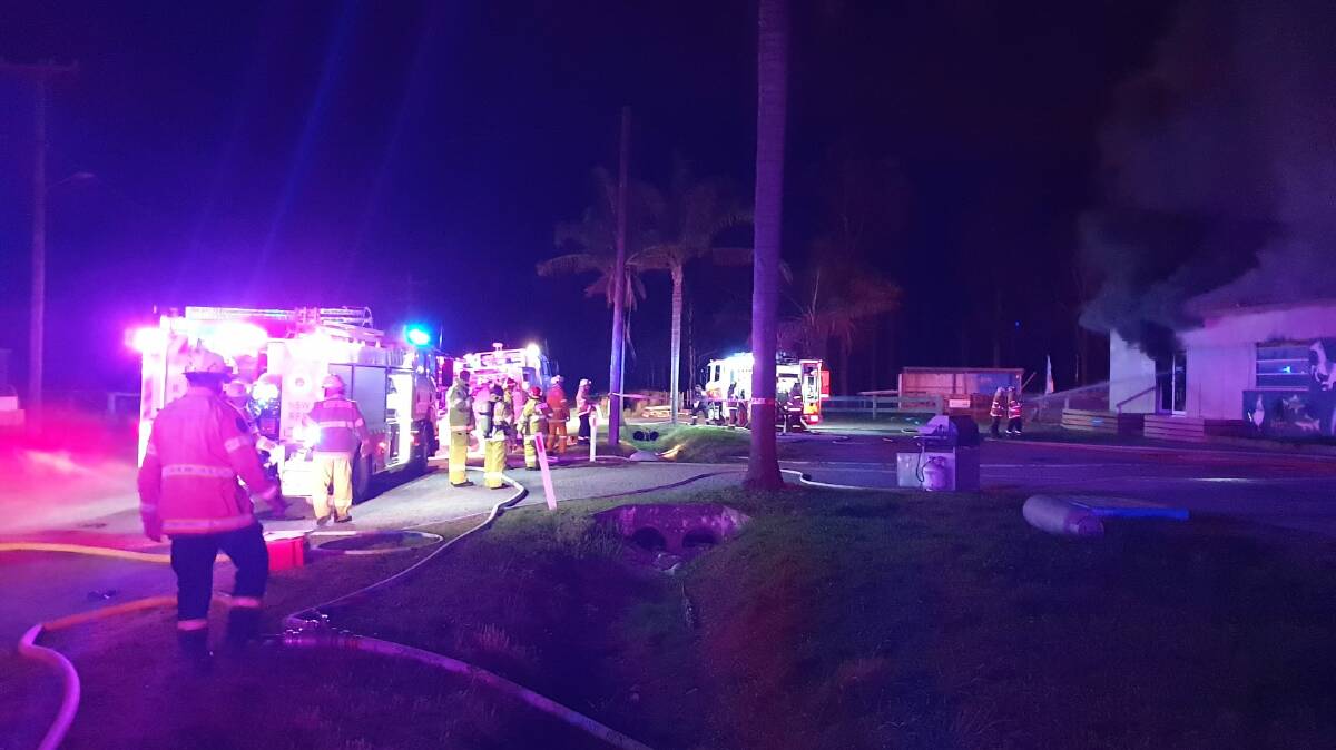 BIG EFFORT: Seven Rural Fire Service and three Fire and Rescue NSW crews were called to the blaze in the Jervis Bay Stock Feeds building on the Old Princes Highway at Falls Creek.