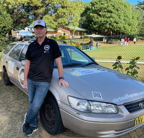 READY TO GO: David Poynter with his car at the Nowra Croquet Club. 
