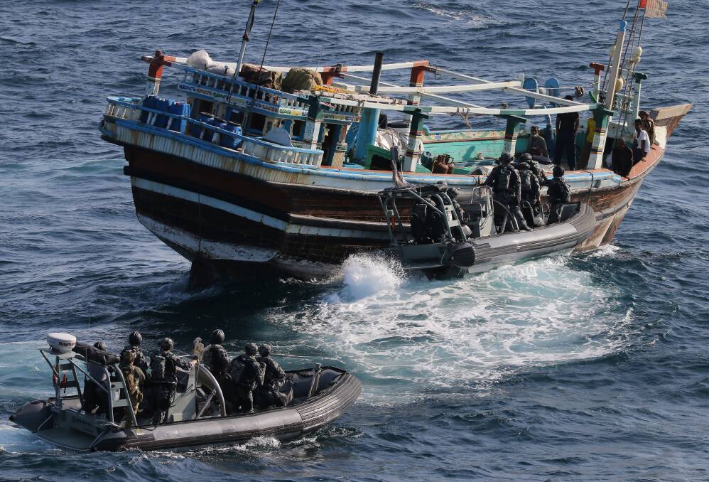 HMAS Ballarat's boarding party conduct a flag verification boarding on a suspicious dhow resulting in a seizure of suspected narcotics. Photo: Bradley Darvill