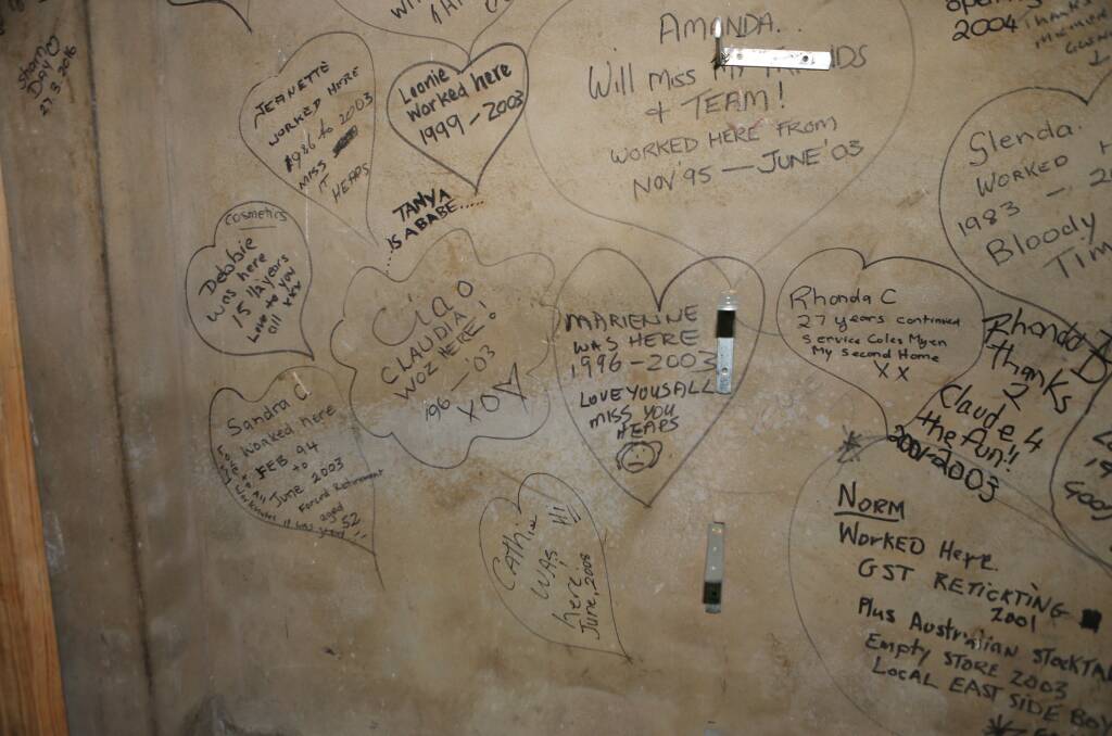 HISTORY: Staff members names written on the wall under the ornate staircase.